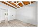 A bedroom featuring a wood ceiling, contemporary ceiling fan, and light flooring at 8234 Midnight Pass Rd, Sarasota, FL 34242