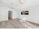 Bright bedroom features neutral decor, wood floors, recessed lighting, and two closets at 8234 Midnight Pass Rd, Sarasota, FL 34242