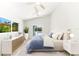 Bright bedroom with a ceiling fan, nice furniture and view of the pool at 8234 Midnight Pass Rd, Sarasota, FL 34242