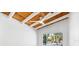 Bedroom featuring a wood ceiling, large window, and contemporary ceiling fan at 8234 Midnight Pass Rd, Sarasota, FL 34242