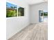 Bright living room with a view of the pool and modern windows at 8234 Midnight Pass Rd, Sarasota, FL 34242