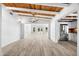 Open concept living room featuring white walls and stainless steel appliances at 8234 Midnight Pass Rd, Sarasota, FL 34242