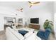 Bright and airy living room boasts high ceilings, modern decor, and seamless transition to dining area at 8234 Midnight Pass Rd, Sarasota, FL 34242