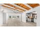 Open-concept living space seamlessly connecting to kitchen and a pool view at 8234 Midnight Pass Rd, Sarasota, FL 34242