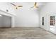Living room boasts high ceilings, modern ceiling fans and wood-look floors at 8234 Midnight Pass Rd, Sarasota, FL 34242