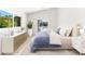 Main bedroom features neutral decor, hardwood floors, recessed lighting, and a view to the backyard pool at 8234 Midnight Pass Rd, Sarasota, FL 34242