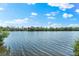 Picturesque water view showcasing calm waters and lush greenery along the shoreline at 8234 Midnight Pass Rd, Sarasota, FL 34242