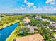 Serene aerial view featuring homes with pools, mature landscaping, and waterfront access at 8930 Bloomfield Blvd, Sarasota, FL 34238