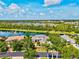 Breathtaking aerial view showcasing the home's beautiful setting and surrounding community at 8930 Bloomfield Blvd, Sarasota, FL 34238