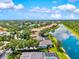 Stunning aerial view capturing the community's waterfront homes and lush landscape at 8930 Bloomfield Blvd, Sarasota, FL 34238