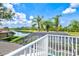 Open balcony view of tropical landscape and lake at 8930 Bloomfield Blvd, Sarasota, FL 34238