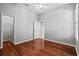 Bedroom featuring hardwood floors, neutral walls, and a ceiling fan at 8930 Bloomfield Blvd, Sarasota, FL 34238