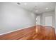Spacious bedroom featuring hardwood floors, a ceiling fan, and a closet at 8930 Bloomfield Blvd, Sarasota, FL 34238