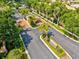 Well-maintained community entrance featuring a gatehouse, palm trees, and signage at 8930 Bloomfield Blvd, Sarasota, FL 34238