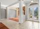 Elegant foyer with tile flooring, decorative glass doors, and an open view to the dining area at 8930 Bloomfield Blvd, Sarasota, FL 34238