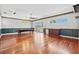Open game room featuring a pool table, bar, and hardwood floors at 8930 Bloomfield Blvd, Sarasota, FL 34238