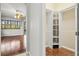 Hallway view of bedroom, closet, and natural light from a large window at 8930 Bloomfield Blvd, Sarasota, FL 34238