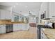 Well-equipped kitchen features granite countertops, stainless steel appliances, and a view of the living area at 8930 Bloomfield Blvd, Sarasota, FL 34238
