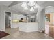 Open kitchen with granite countertops, modern appliances, and a breakfast bar for casual dining at 8930 Bloomfield Blvd, Sarasota, FL 34238