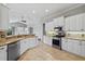 Well-equipped kitchen features granite countertops, stainless steel appliances, and a view of the living area at 8930 Bloomfield Blvd, Sarasota, FL 34238