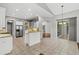 Spacious kitchen with a breakfast bar that overlooks the living room and backyard at 8930 Bloomfield Blvd, Sarasota, FL 34238