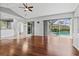 Bright living room with hardwood floors and view of the pool at 8930 Bloomfield Blvd, Sarasota, FL 34238