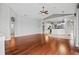 Large living room featuring hardwood floors, neutral walls, and plenty of natural light at 8930 Bloomfield Blvd, Sarasota, FL 34238