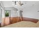Open living room featuring hardwood floors, recessed lighting, and sliding glass doors to the backyard at 8930 Bloomfield Blvd, Sarasota, FL 34238