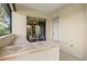 Covered patio area showcases a built-in bar and easy access to the home's interior at 8930 Bloomfield Blvd, Sarasota, FL 34238
