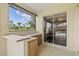 Outdoor patio features a charming bar area and sliding glass doors for indoor/outdoor living at 8930 Bloomfield Blvd, Sarasota, FL 34238