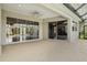 Covered patio area with tile flooring, great for entertaining at 8930 Bloomfield Blvd, Sarasota, FL 34238