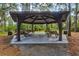 Community pavilion with picnic tables providing a gathering space surrounded by nature at 8930 Bloomfield Blvd, Sarasota, FL 34238
