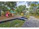 Neighborhood playground featuring multiple play structures and open areas for to enjoy at 8930 Bloomfield Blvd, Sarasota, FL 34238
