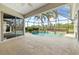 Outdoor pool with tropical landscaping and pavers at 8930 Bloomfield Blvd, Sarasota, FL 34238