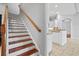 Staircase featuring wood stairs with white risers at 8930 Bloomfield Blvd, Sarasota, FL 34238