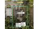 Aerial view of the property, including the house, studio, and garden gallery at 1019 10Th W Ave, Bradenton, FL 34205