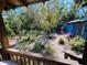 Backyard patio with seating area, lush landscaping and unique metal shed at 1019 10Th W Ave, Bradenton, FL 34205