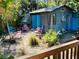 Backyard patio with colorful shed, garden and a seating area at 1019 10Th W Ave, Bradenton, FL 34205