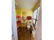 Bright, yellow bathroom with colorful shower curtain and tile flooring at 1019 10Th W Ave, Bradenton, FL 34205