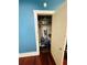 Blue room closet with organizers and white trim open door at 1019 10Th W Ave, Bradenton, FL 34205