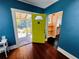 Bright entryway with colorful door leading to outdoor area at 1019 10Th W Ave, Bradenton, FL 34205