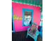 Colorful front porch with bright seating and flower mural at 1019 10Th W Ave, Bradenton, FL 34205