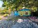 Colorful cottage surrounded by lush vegetation at 1019 10Th W Ave, Bradenton, FL 34205