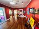 Charming gallery featuring hardwood floors, track lighting, and colorful artwork on display at 1019 10Th W Ave, Bradenton, FL 34205
