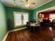 Quaint gallery features hardwood floors, a ceiling fan, and a decorative display case at 1019 10Th W Ave, Bradenton, FL 34205