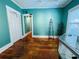 An emerald gallery with hardwood floors, gallery lighting and access to the next room at 1019 10Th W Ave, Bradenton, FL 34205