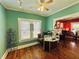 Charming gallery features hardwood floors, a ceiling fan, and a decorative display case at 1019 10Th W Ave, Bradenton, FL 34205