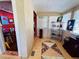 Hallway featuring hardwood floors, beadboard ceilings, and a window letting in natural light at 1019 10Th W Ave, Bradenton, FL 34205