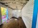 View of the interior with wood floors, white walls and trim, and blue doors at 1019 10Th W Ave, Bradenton, FL 34205