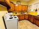 A kitchen boasts upper and lower wood cabinetry with a vintage white range at 1019 10Th W Ave, Bradenton, FL 34205